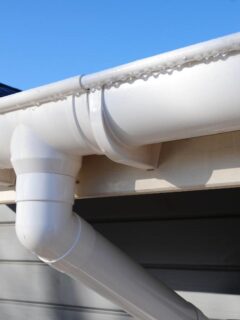 new gutter installation on a gray home