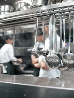 utensils hanging in a restaurant kitchen