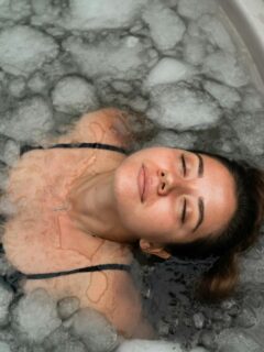 woman looking relaxed and refreshed in an ice bath
