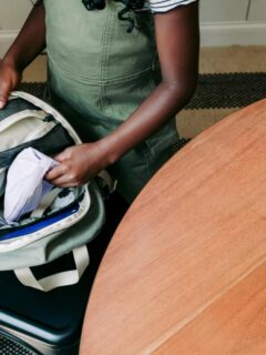 Child packing a school backpack on Sunday evening.