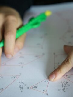 young person working on geometry problems