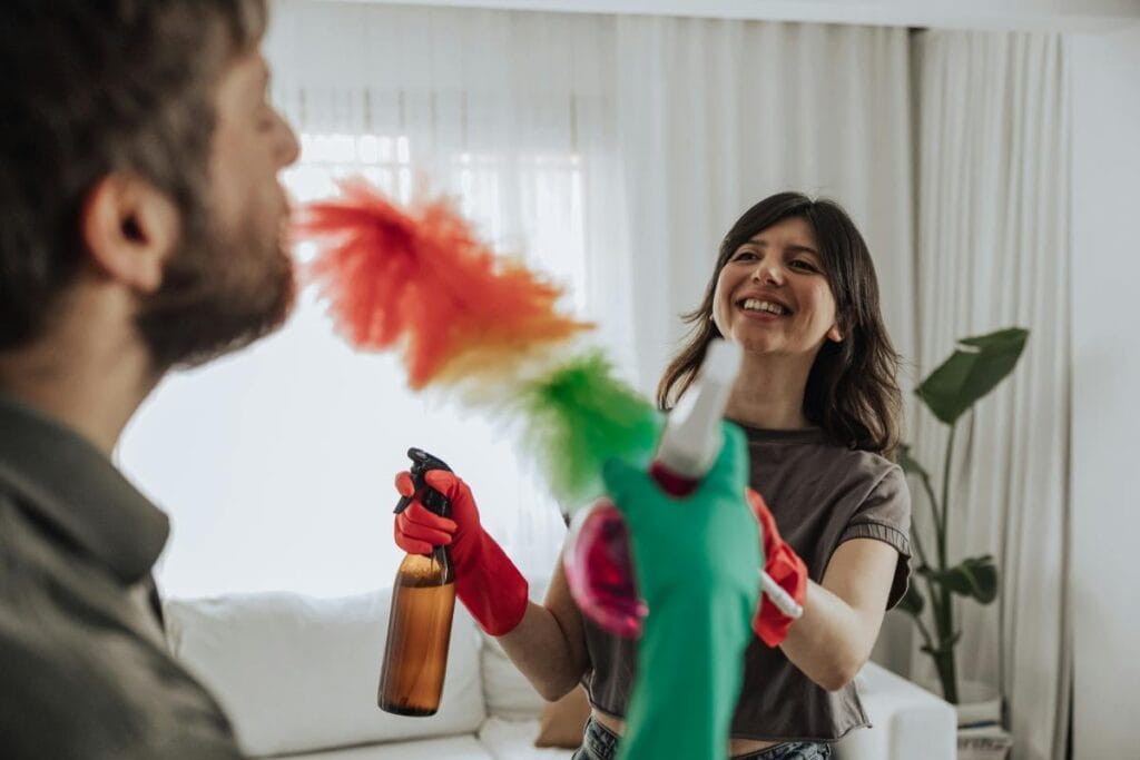 happy couple cleaning
