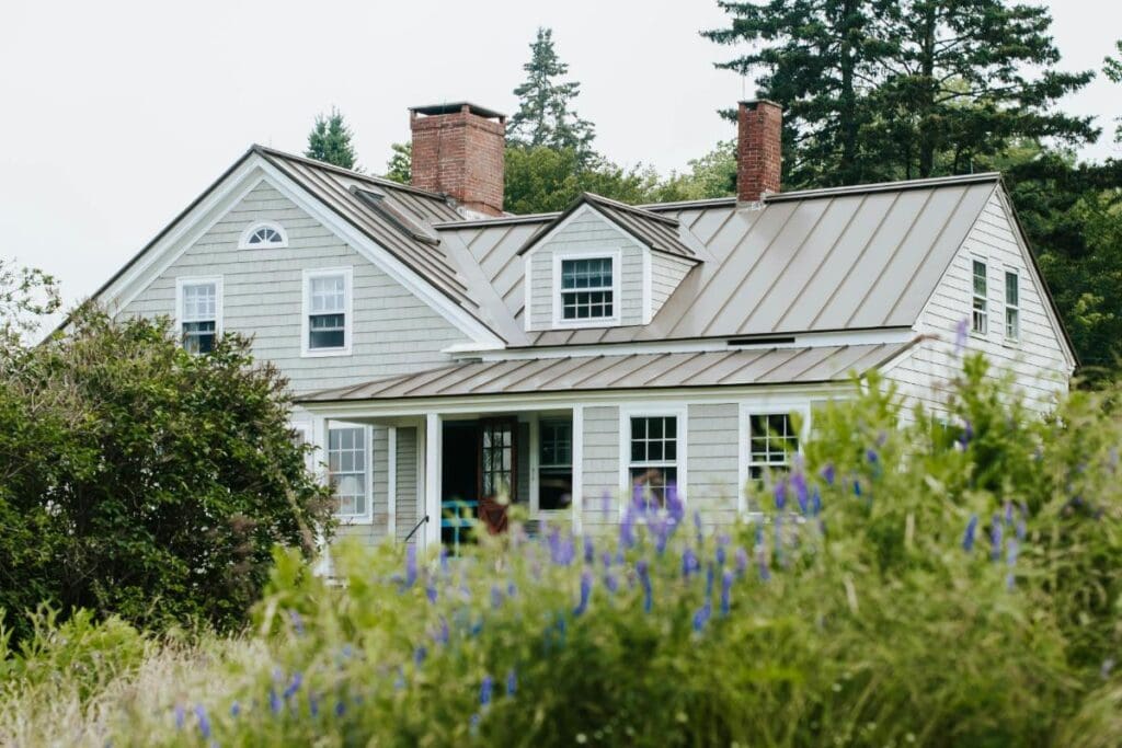 Modern house with a durable standing seam metal roof.