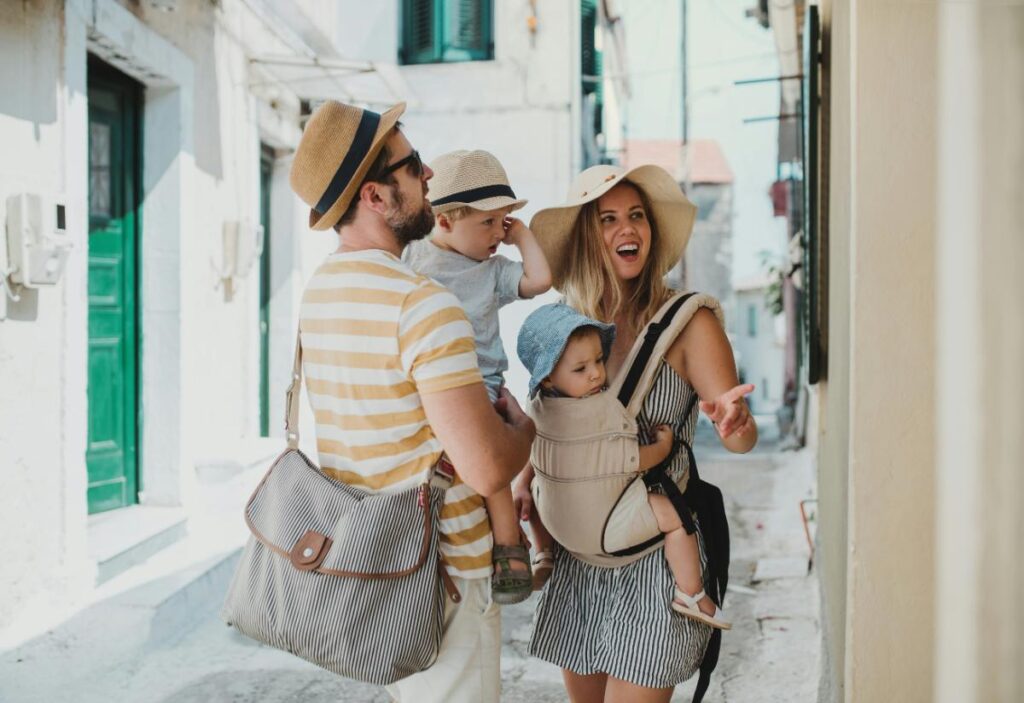 couple traveling in new city with two toddlers