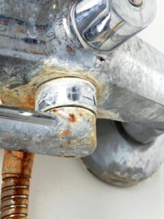 crusty and corroded bathroom fixtures