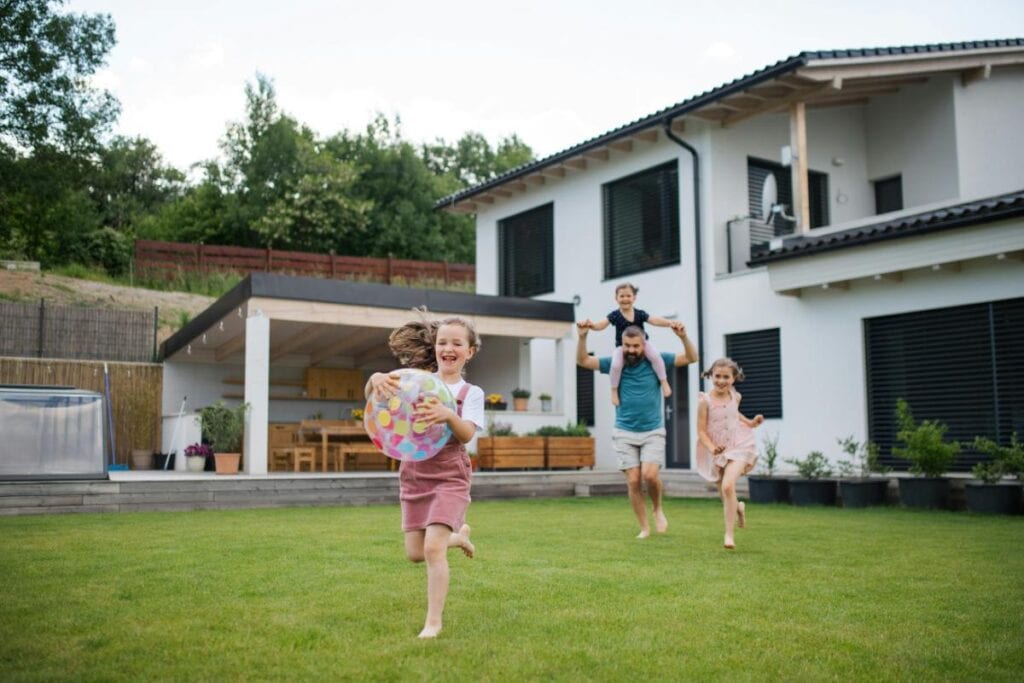 family running in backyard