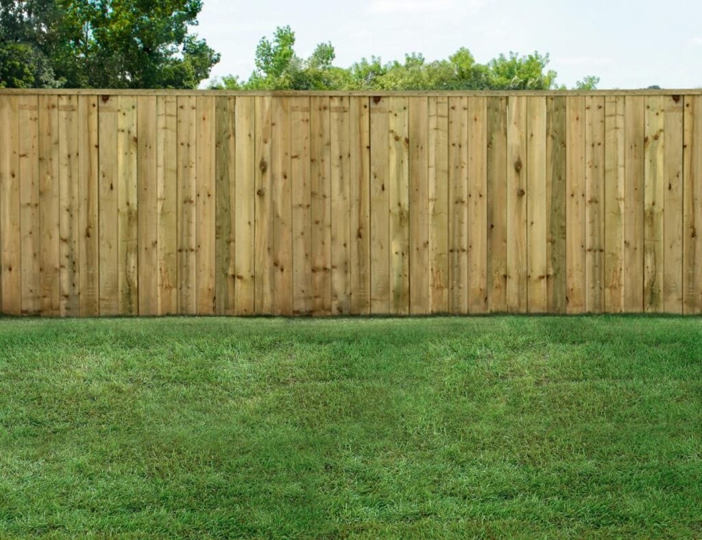 green grass with fence in backyard
