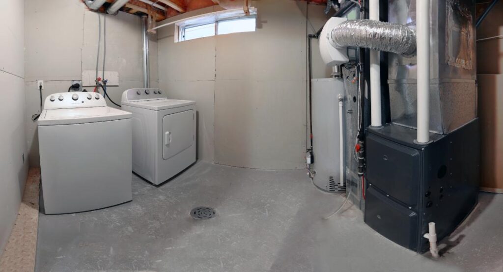 washer dryer and furnace in a basement