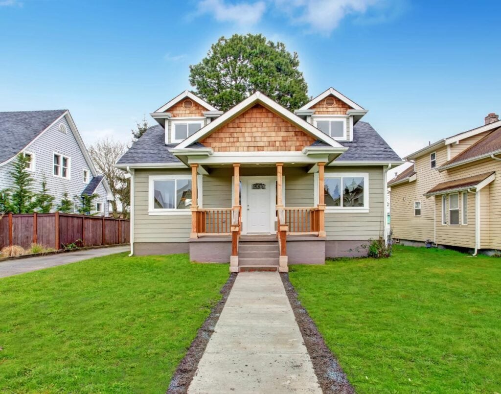Small craftsman-style house with dormers and a front porch