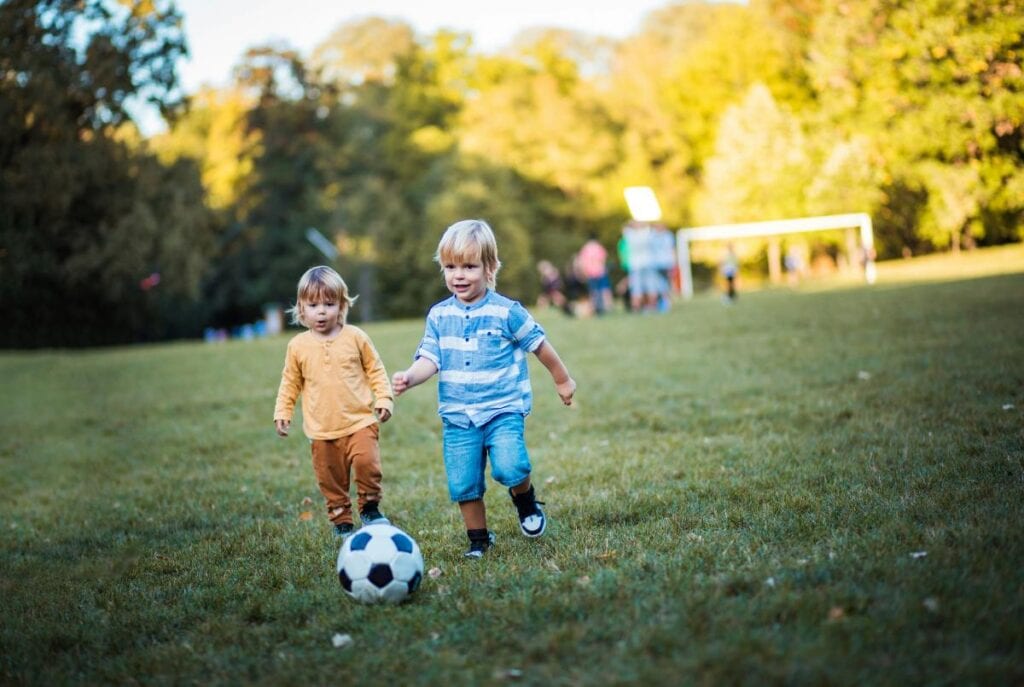 toddlers playing soccer