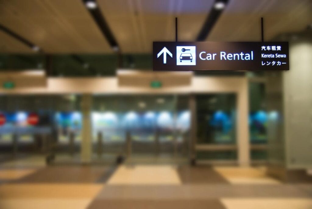 a car rental sign at the airport